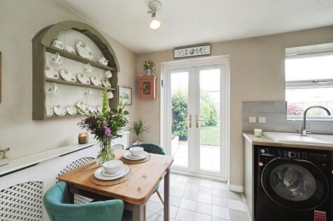 Bright Kitchen and Dining Space with Double Doors