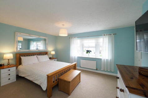 Large Master with built in wardrobe and en suite.