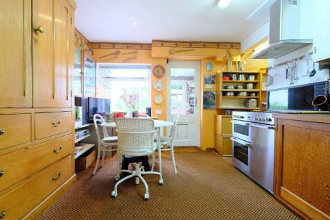 Kitchen with doors to pantry