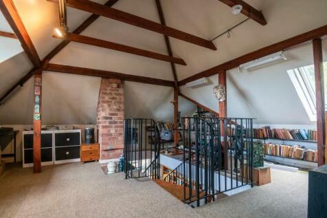 Home office with vaulted ceilings