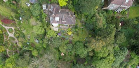 Drone shot of land and house
