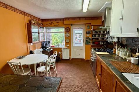Kitchen, small utility area and larder