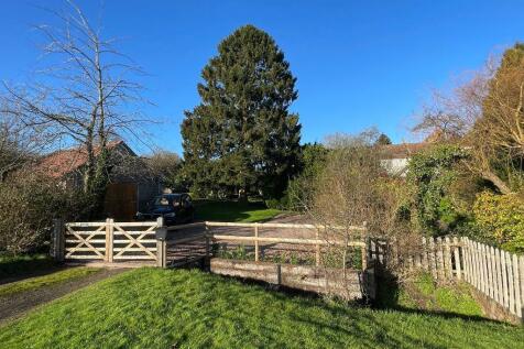 Gated entrance, driveway and garage