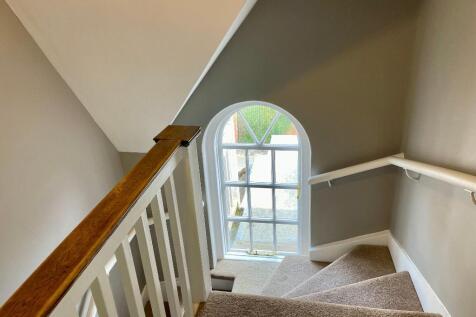 Sunlight filled staircase to bedrooms