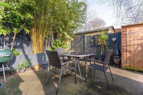 Sunny patio at rear of garden