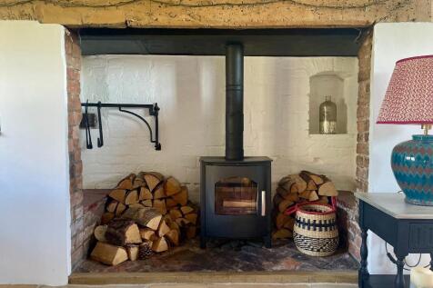 Inglenook fireplace with log burner