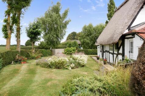 Rear garden and field views