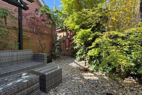 Rear garden leading to garage
