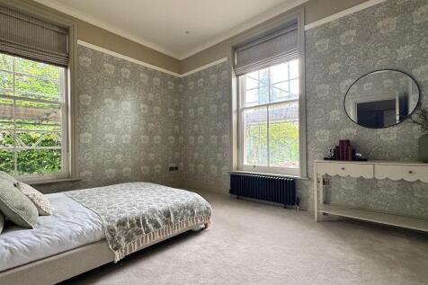 Bedroom 1 with private garden views
