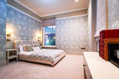 Bedroom 1 with private garden views