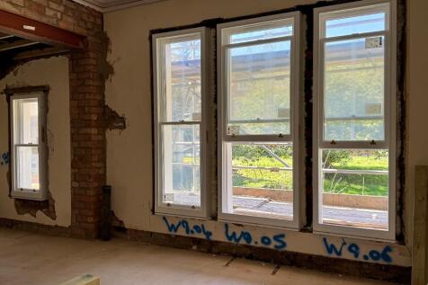 New wooden sash windows throughout