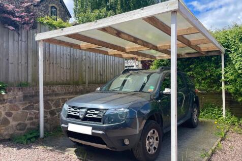 Car port located at end of the drive