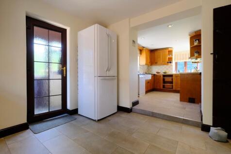 Country kitchen and entrance to house