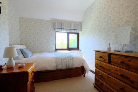 Bedroom 4 with garden views