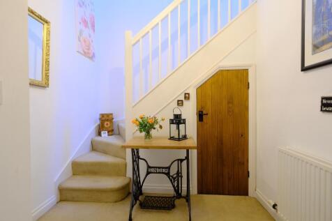 Entrance hall with understairs storage