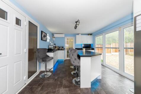 Kitchen with sliding doors to garden