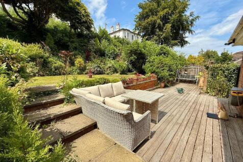 Large deck and pretty gardens