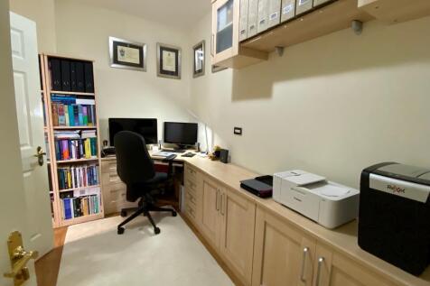 Office with fitted desk and furniture