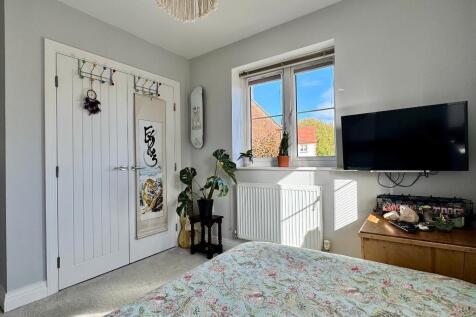 Bedroom 2 with fitted wardrobe