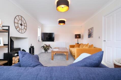 Comfy sitting room with log burner