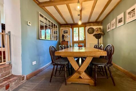 Large dining area opposite the kitchen