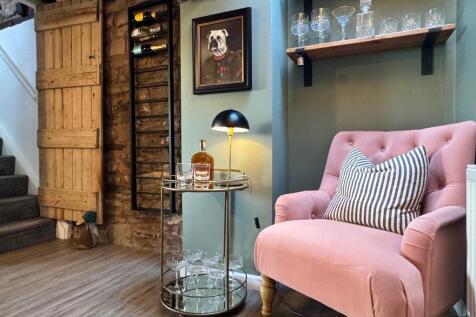 Shows wooden door and stone work