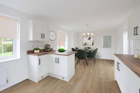 An open plan kitchen dining area is perfect for entertaining family and friends