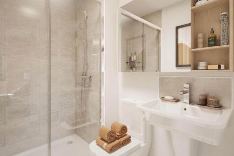 A private en-suite leads from the main bedroom