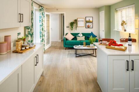 An open plan family dining area features double doors to the garden
