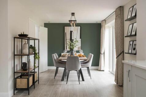 Double doors lead from the dining area to the garden, perfect for alfresco dining