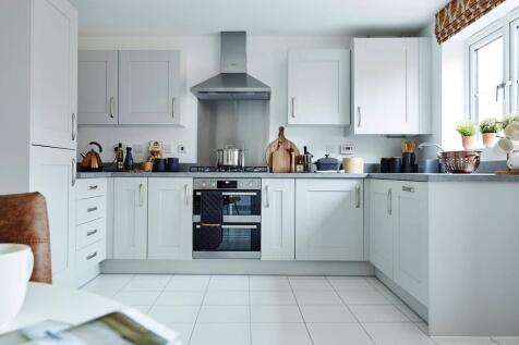 The kitchen offers a hub of the home with space for a dining area