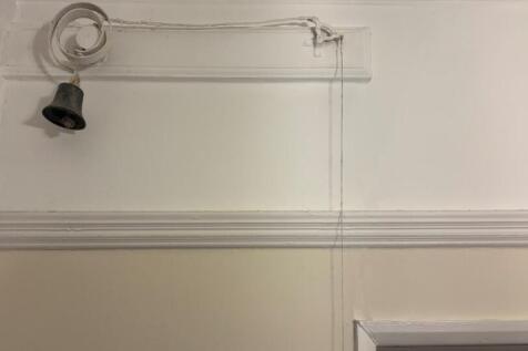 detail of bell pulley system hallway