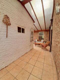 Covered Rear Entrance/Sitting Area
