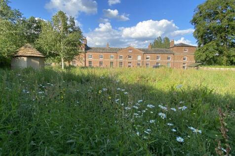 Rear elevation over wild flower meadow