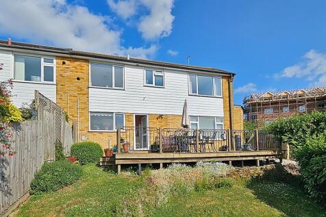 A house with a deck and a garden.