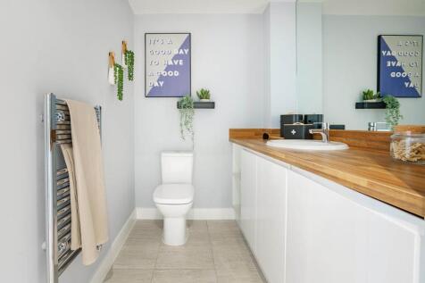 A cloakroom and utility area offers space for laundry appliances and completes the ground floor