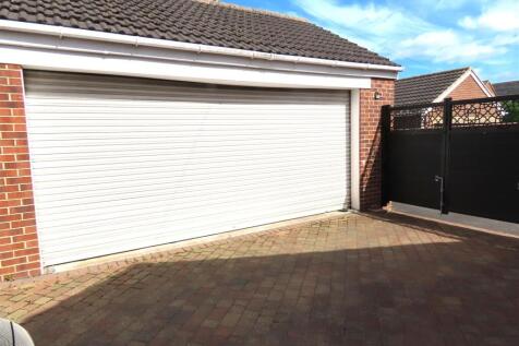 DETACHED BRICK BUILT DOUBLE GARAGE