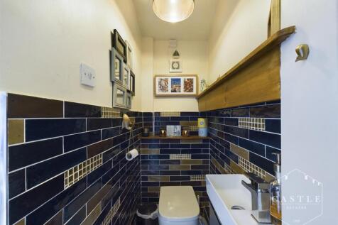 GUEST CLOAKROOM/UTILITY SPACE