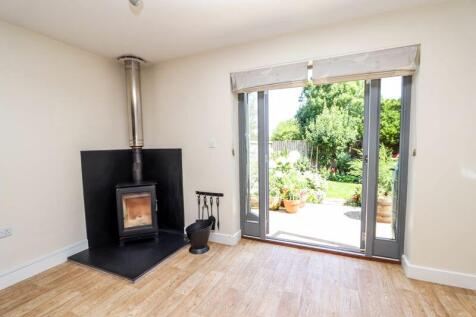 Woodburning Stove and doors to garden