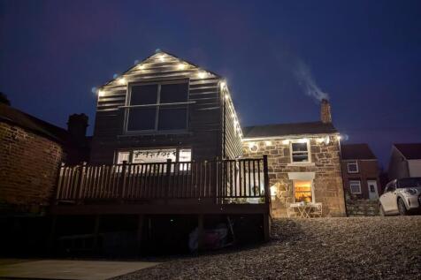 FRONT ASPECT AT TWILIGHT