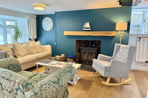 Cosy sitting room with log burner