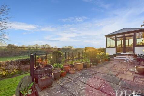 Rear patio and sun room