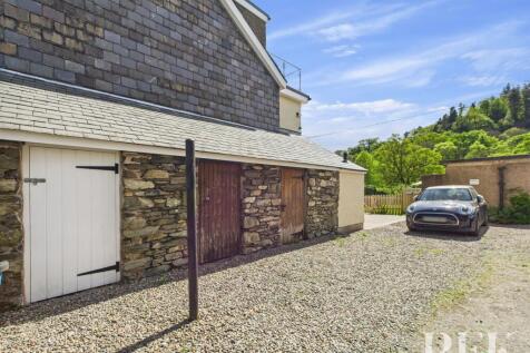 Side outhouse (white door) and Parking