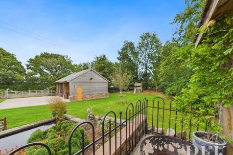 View from Gazebo to Play Area &amp; Garage
