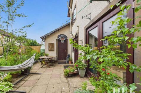 Rear patio and door to garage