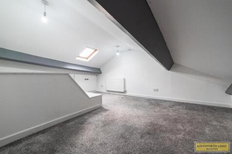 ATTIC ROOM WITH CUPBOARD STORAGE