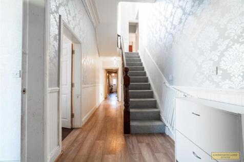 HALLWAY AND STAIRS TO FIRST FLOOR