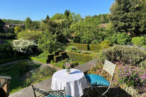 The hidden roof terrace enjoys sunny secret views over the walled garden