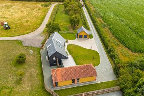 Long private drive and orchard