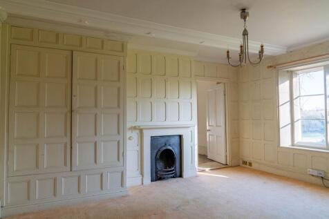 panelled bedroom with fitted storage